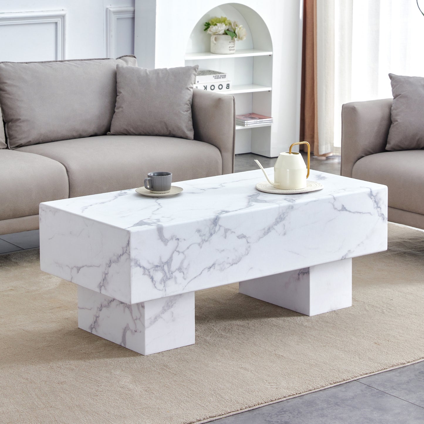 The white coffee table has patterns. Modern rectangular table, suitable for living rooms and apartments. 43.3'*21.6'*17.2'