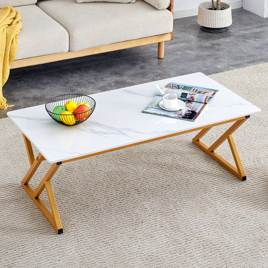 A coffee table made of rock slab material, with a smooth and natural surface that complements the modern design of the golden metal legs, making it suitable for living rooms of all sizes.47*23.6